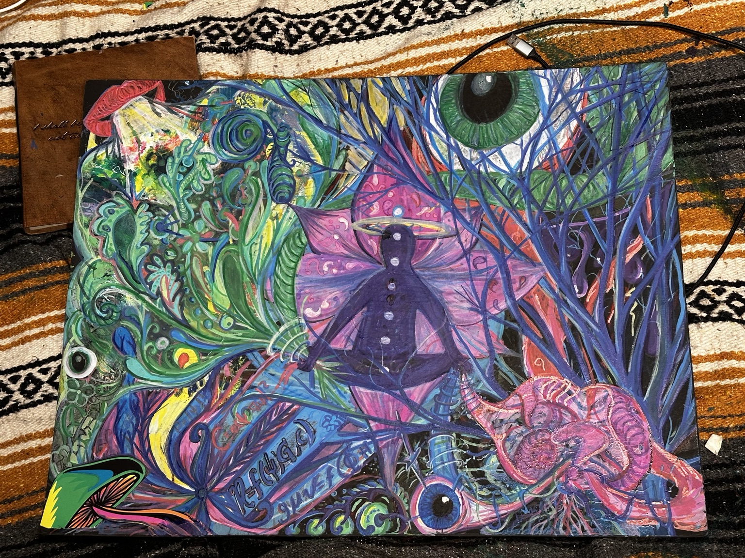 Large psychedelic mixed-media artwork with eye and central figure